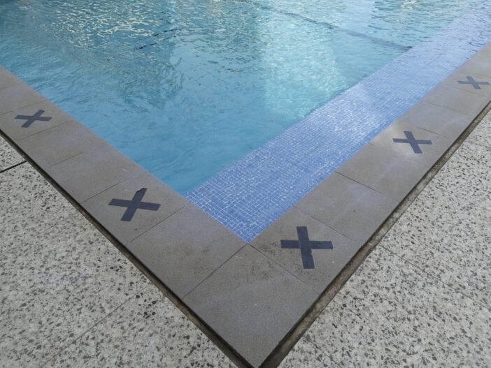 Key Differences: Quartz vs Pebble Pool Finish - Swimmer Living